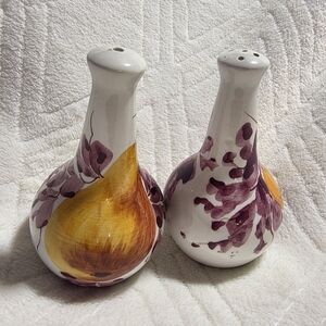 Vintage ceramic salt and pepper shakers, likely hand-painted and made in Italy